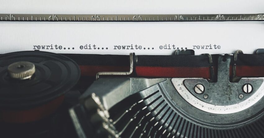 Classic typewriter with text 'rewrite... edit...' on paper.